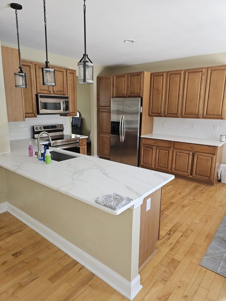 kitchen remodel with wood cupboards and silver appliances