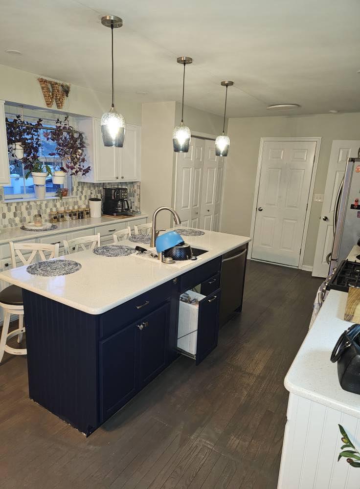 kitchen remodel with island and white cupboards